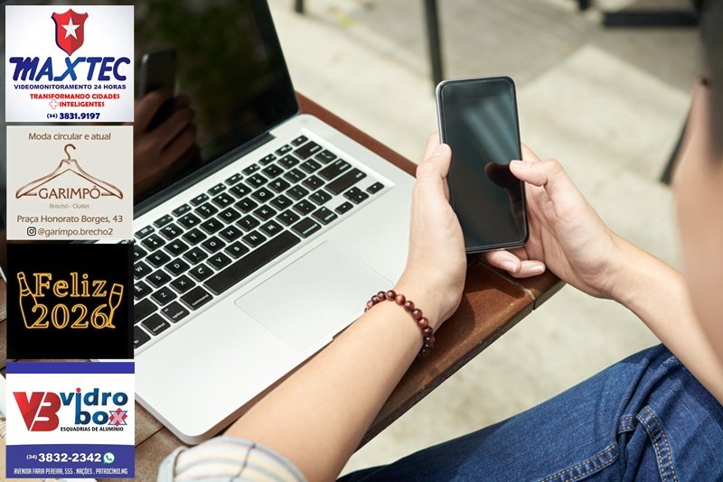 Hands of man using application on smartphone, view over the shoulder