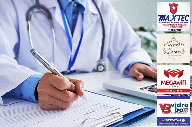 Doctor checking information in computer program before filling medical card